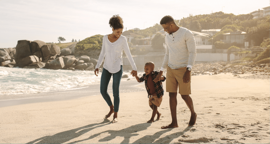 Family on beach vacation budgeting 