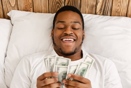 happy-man-counting-and-changing-his-money-mindest