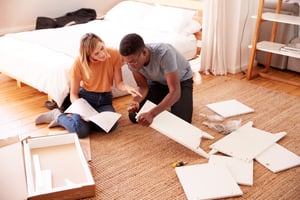 couple in new home putting together self assembly