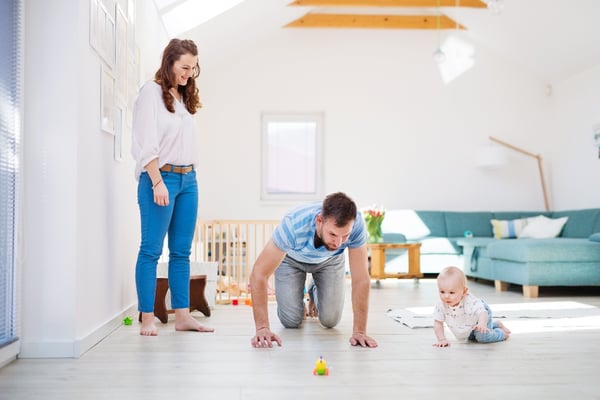 young-family-playing-with-a-baby-boy-at-home-J82675R-1